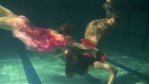 Two hot lesbians underwater touching eachother